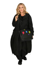 Winter shoulder bag in a straight shape made of fine quality leather, baggy in black with polka dots