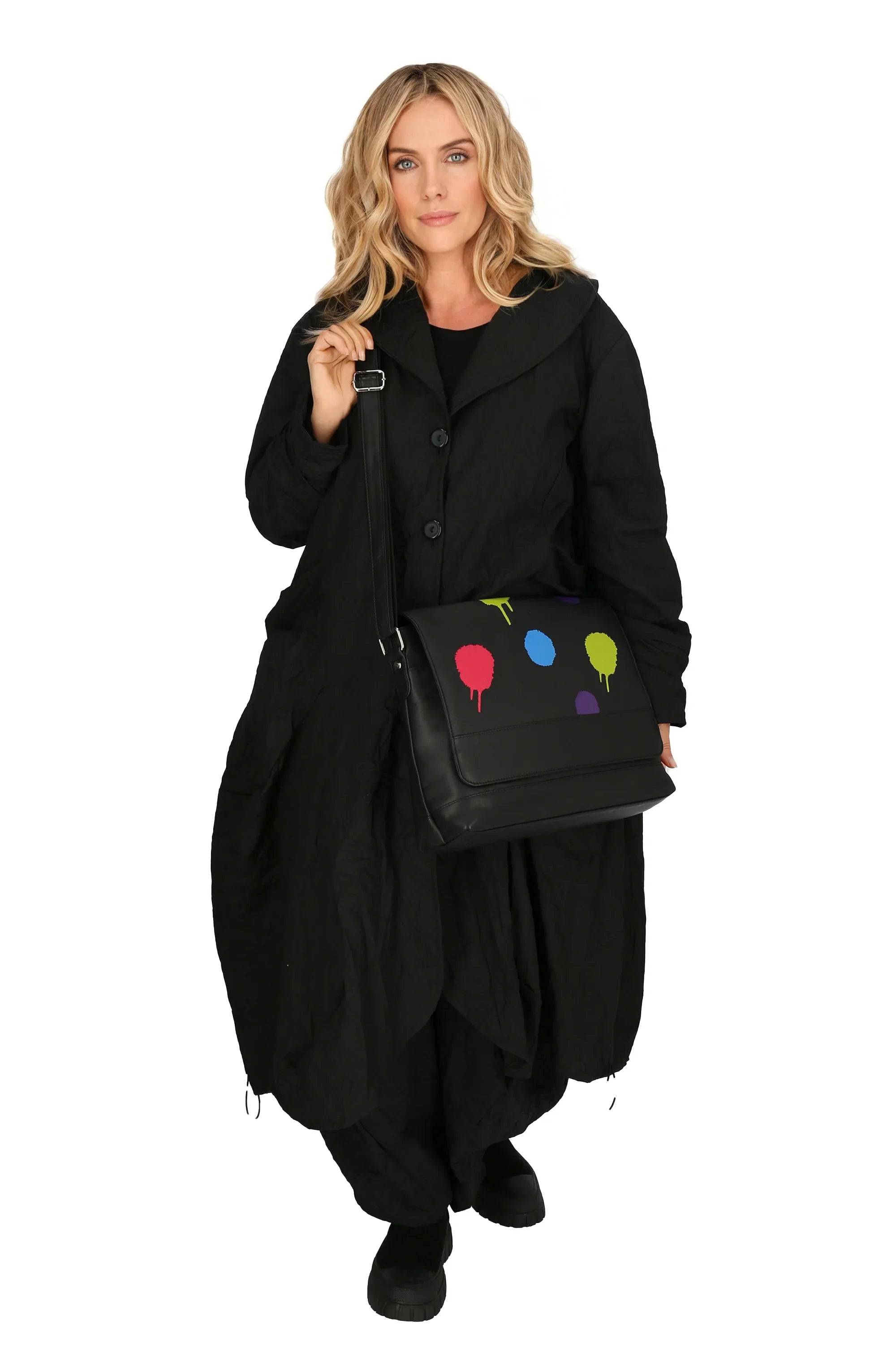 Winter shoulder bag in a straight shape made of fine quality leather, baggy in black with polka dots