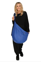 Everyday bag in a balloon shape, made of smooth, high-quality leather, baggy style in royal blue