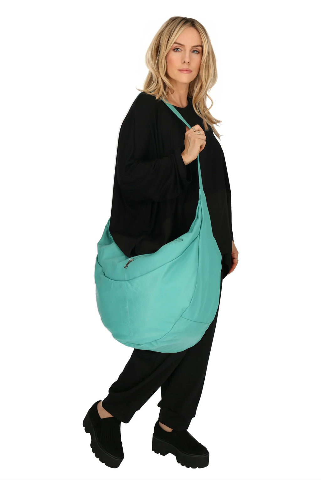 Everyday bag in a balloon shape, made of smooth, high-quality leather, baggy style in turquoise.