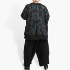 Winter jacket in A-shape made of fine Romanit jersey quality, petrol in black-petrol